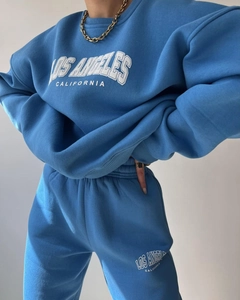 Detail of blue Los Angeles fleece sweatshirt and matching jogger pants set for women