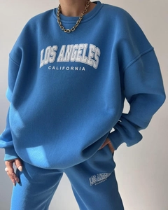Detail of Los Angeles print on bright blue thick cotton sweatshirt and matching sweatpants