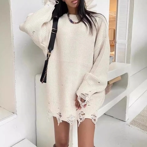 Oversized beige distressed knit sweater with long sleeves and stylish ripped details