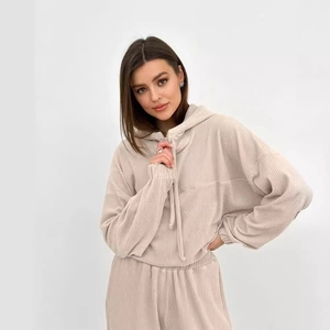 Women's beige corduroy two-piece tracksuit featuring hooded sweatshirt and joggers