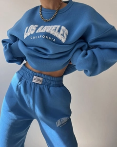 Detail of Los Angeles embroidery on blue fleece sweatshirt and matching jogger pants