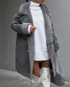 Macro shot of gray suede shearling coat with plush trimming and large notched lapel