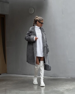Fashionable long dark grey faux fur suede coat with high white platform boots detail