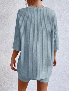 Detailed back view of casual Morandi blue ribbed knit two-piece shorts set for women