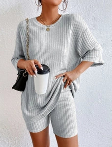 Detailed texture of grey ribbed knit loungewear set with loose T-shirt and cycling shorts