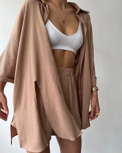 Detail of ochre brown summer set showing waffle texture fabric and high side slit shirt