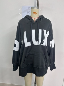 Detail of grey oversized hoodie showing white LUX letter print and kangaroo pocket