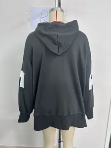 Detail view of charcoal oversized hoodie back with drop shoulder and ribbed cuffs