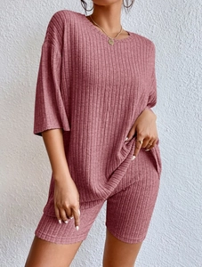Detail of mauve ribbed knit lounge set featuring short sleeve top and cycling shorts