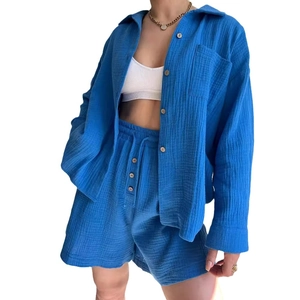 Women's royal blue two-piece lounge set with long sleeve button shirt and drawstring shorts