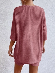 Detailed back view of dark pink ribbed knit two-piece set with loose top and shorts
