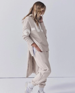 Detail of oat beige oversized hoodie with side zippers and P-LU letter print for women