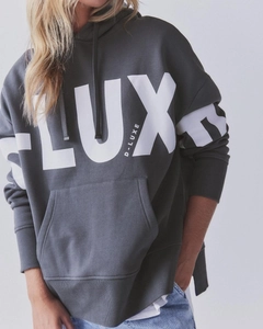 Detail of oversized dark grey hoodie with white LUXE letter print and kangaroo pocket