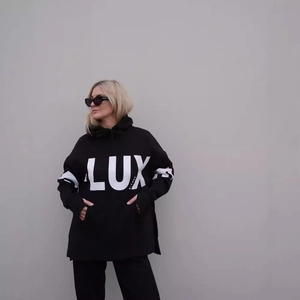 Women's oversized black hoodie featuring white LUX letter print and a kangaroo pocket