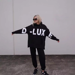 Women's oversized black tracksuit with large white D-LUX E letter print on hoodie and joggers