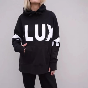 Women's black oversized hoodie with white LUX letter print and kangaroo pocket