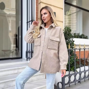 Women's beige sherpa shacket with lapel collar and flap chest pockets in a street style look
