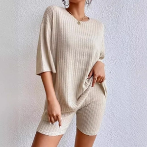 Minimalist oatmeal ribbed knit two-piece set featuring short sleeve top and high waist shorts