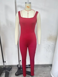 Detail view of the ribbed fabric texture on this red square-neck sleeveless jumpsuit