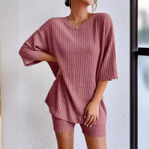 Women's rib-knit two-piece lounge set with drop shoulder top and cycling shorts in dusty pink