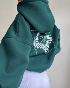 Felpa oversize verde scuro con stampa grafica bianca sul retro e polsini a costine