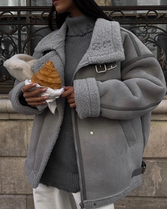 Detail of grey shearling biker jacket showing suede texture and warm faux fur lining