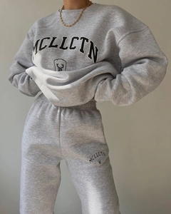 Detail of grey athletic set featuring MCLLCTN letter print and soft ribbed cuffs
