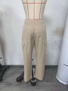 Detail view of khaki high-waisted cargo pants showing back pockets and straight-leg fit