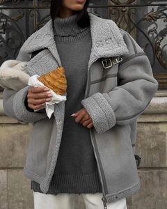 Detail of grey shearling aviator jacket with fuzzy lamb wool collar and zip trim