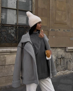 Street style shot of oversized sherpa aviator jacket with suede finish and shearling collar