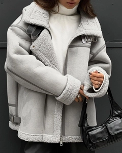 Detail of grey faux shearling aviator jacket with oversized collar and metal hardware
