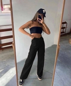 Mirror selfie showing women's high-waisted black cargo pants with large side pockets