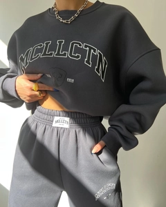 Detailed view of dark grey hoodie set featuring white鹿头 graphic and MCLLCTN branding print