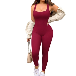 Close-up of ribbed burgundy sleeveless jumpsuit fabric with U-neck detail for women