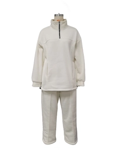 Detail of white two-piece fleece set featuring half-zip stand collar and kangaroo pocket