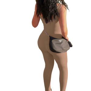 Detailed back view of a dark brown ribbed knit sleeveless jumpsuit with a slim fit