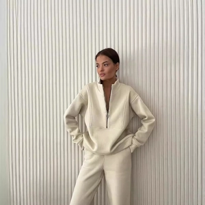 Women's cream two-piece lounge set with half-zip sweatshirt and matching joggers