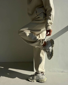 Detailed close-up of cream heavy cotton hoodie set with stylish geometric shadow