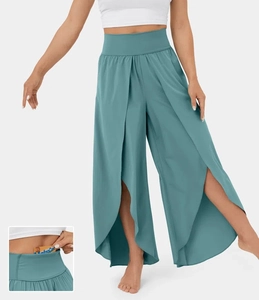 Close-up of the hidden waistband pocket design for cards on teal flared yoga pants