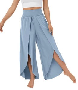 Detail view of high waist yoga wide leg pants with side slits and layered fabric design