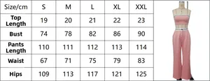 Detailed size chart for pink two-piece crop top and wide-leg trousers from size S to XXL
