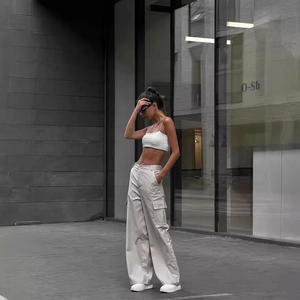 Women's high waist light gray cargo pants with side flap pockets in loose fit