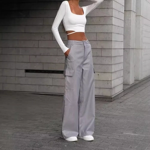 Women's high waist cargo pants with wide leg and white long sleeve crop top outfit