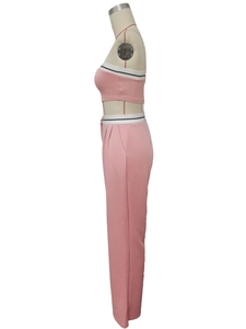 Detail of pink two-piece set featuring striped elastic waistband and slim-fit trousers