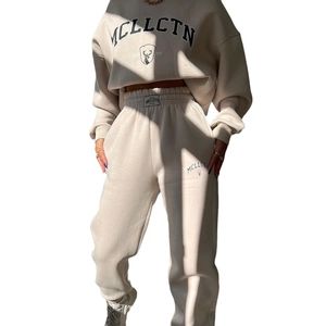 Women's beige warm tracksuits set with hooded sweatshirt and joggers featuring logo print
