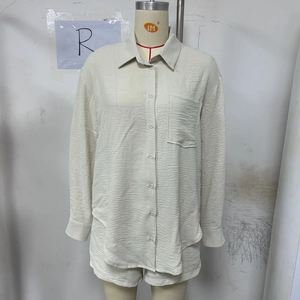 Close-up of beige long sleeve button-up shirt set with micro-wrinkle textured fabric