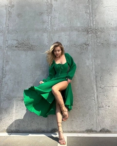 Detailed view of dark green textured fabric with square neck and lace-up front design