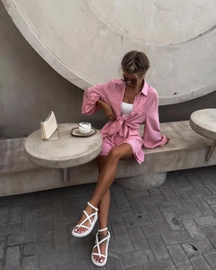 Detail view of pink textured two-piece summer set with long sleeve shirt and matching shorts