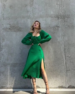 Detailed view of green puff sleeve dress with elegant square neckline and front ties