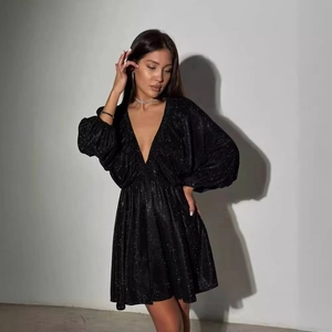 Elegant black V-neck mini dress with sparkly fabric and long puff sleeves for parties